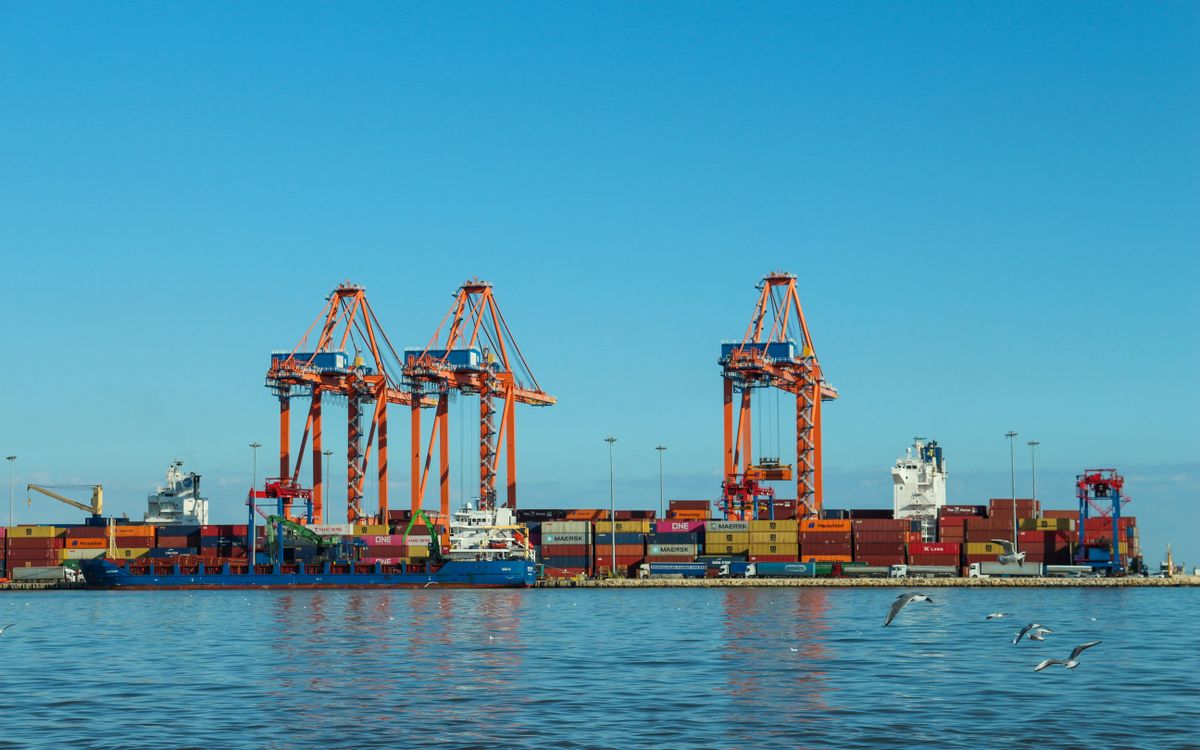 Container ship and cranes at a commercial port